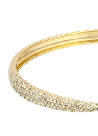 Partial photo of a yellow gold pave diamond bangle bracelet