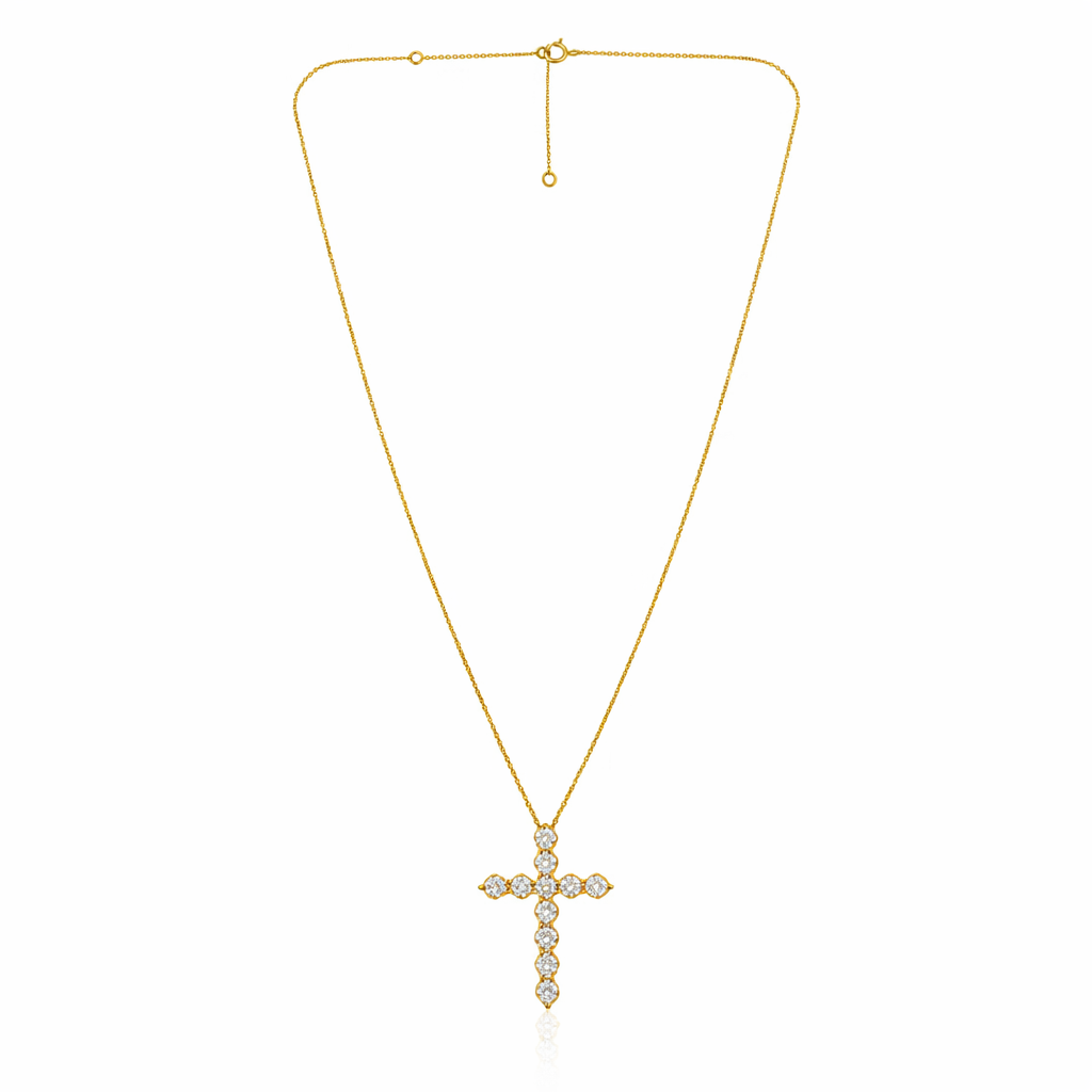 Gold cross necklace with diamonds on a white background