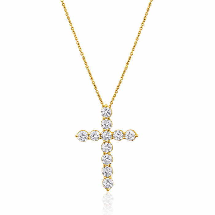 Gold cross necklace with diamonds on a white background