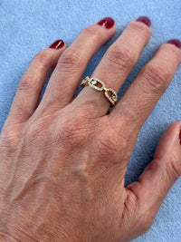 hand with diamond ring with larger diamond