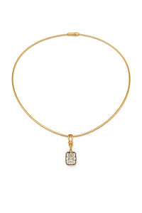 Gold necklace with a rectangular pendant on a white background