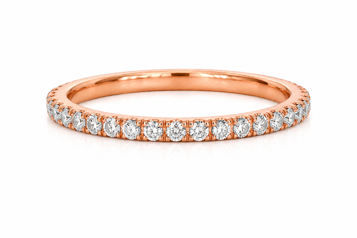 Rose gold ring with diamonds on a white background