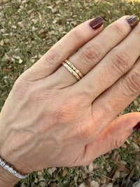 hand with 2 yellow gold rings