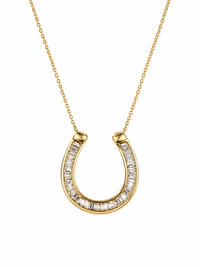 Gold horseshoe-shaped necklace with diamond accents on a white background