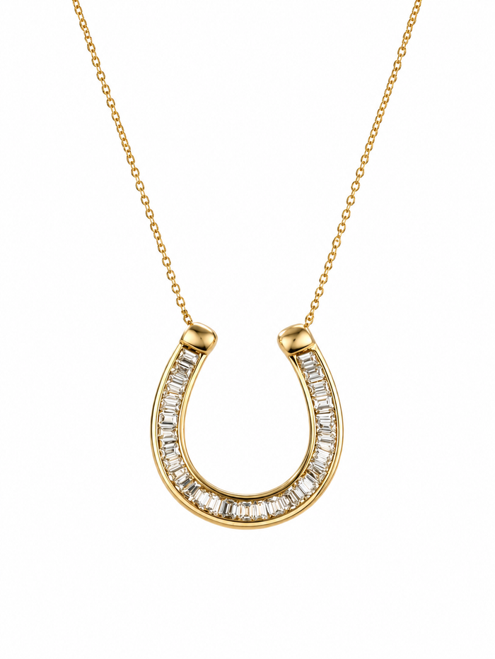 Gold horseshoe-shaped necklace with diamond accents on a white background