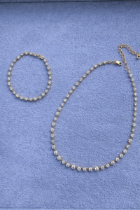 Gold and diamond bracelet and matching necklace