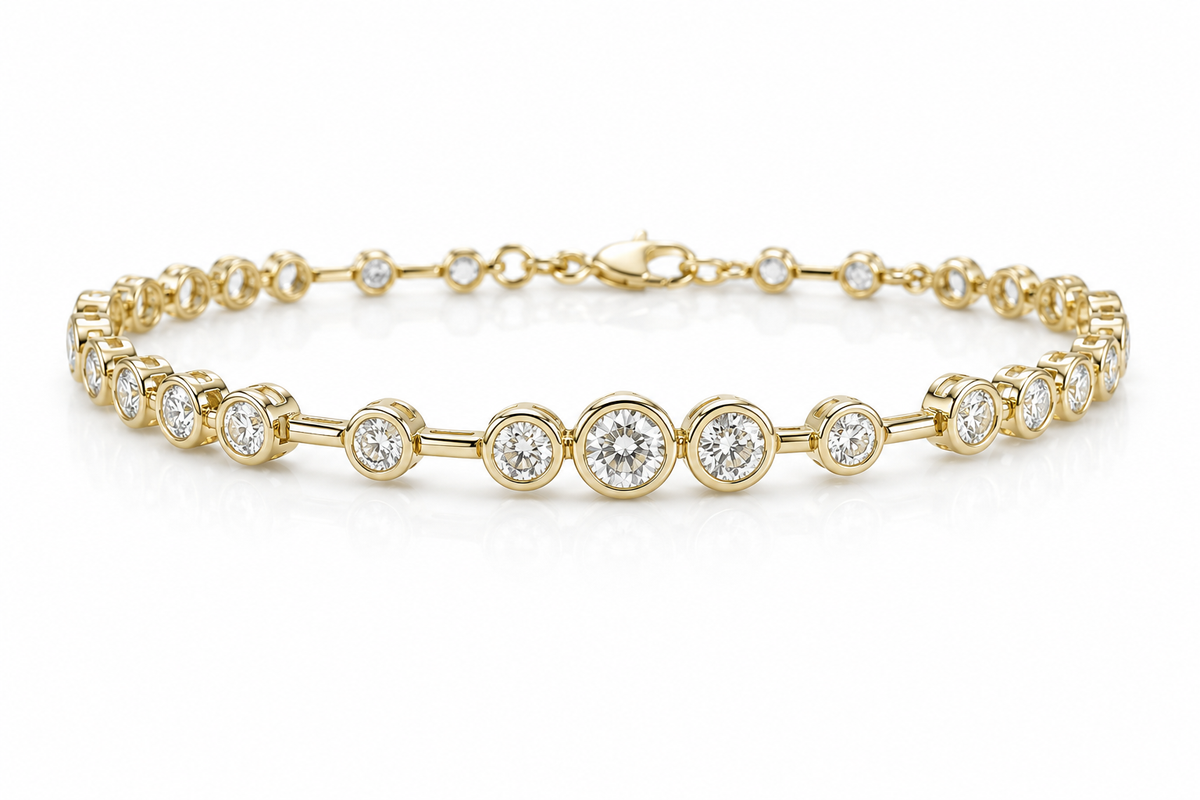 Gold bracelet with bezel set diamond on a white background