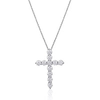Diamond cross necklace on a white background