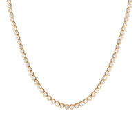 Gold necklace with diamonds on a white background