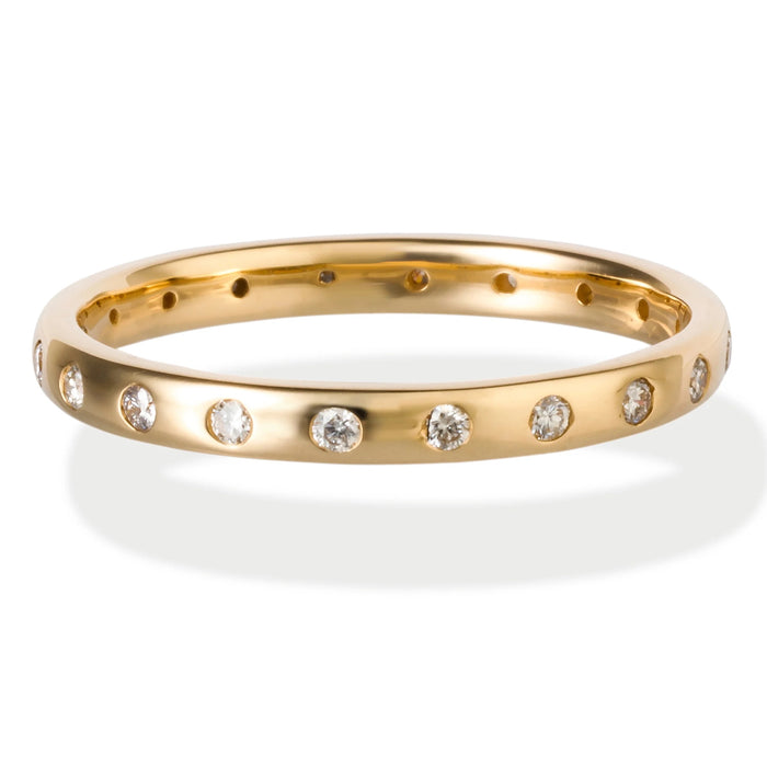 Gold ring with embedded diamonds on a white background