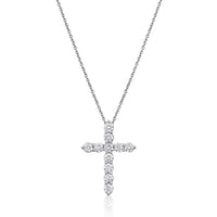 White gold cross necklace with diamonds on a white background