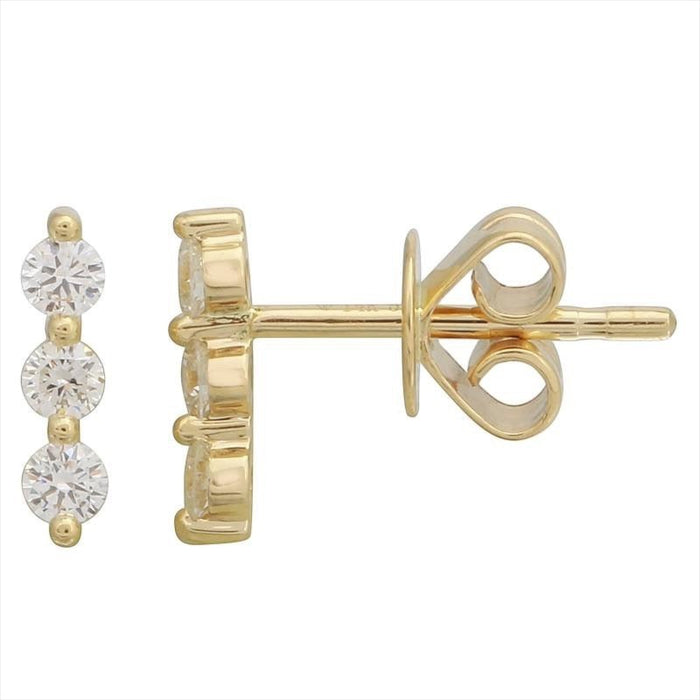 Gold earrings with three circular gemstones on a white background