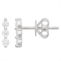 Silver earring with three clear gemstones on a white background