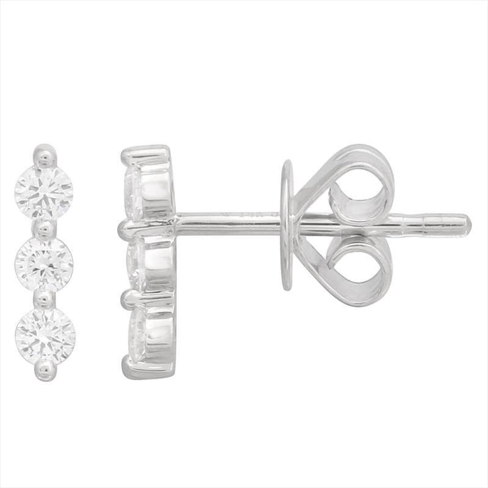 Silver earring with three clear gemstones on a white background