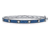 The Karat Concierge Pave Muse bangle in white gold featuring blue pavé gemstones and bezel-set diamonds.