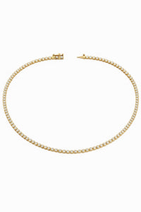 Gold necklace with diamonds on a white background