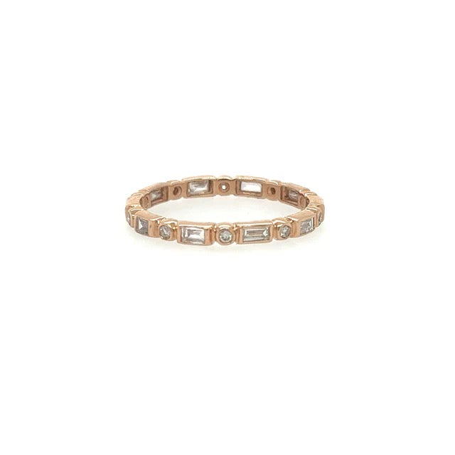 Rose gold ring with embedded diamonds on a white background