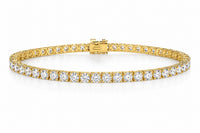 Gold bracelet with diamonds on a white background