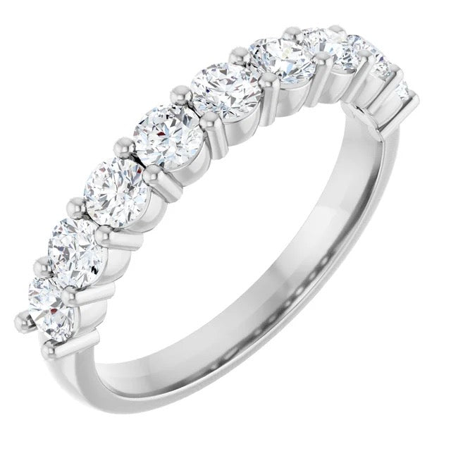 Silver ring with multiple diamonds on a white background