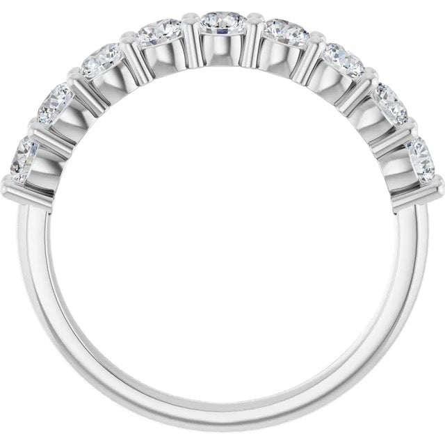 A silver-toned half-circle diamond ring with round-cut stones set along the upper half of the band, shown against a plain white background.