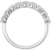 A silver-toned half-circle diamond ring with round-cut stones set along the upper half of the band, shown against a plain white background.