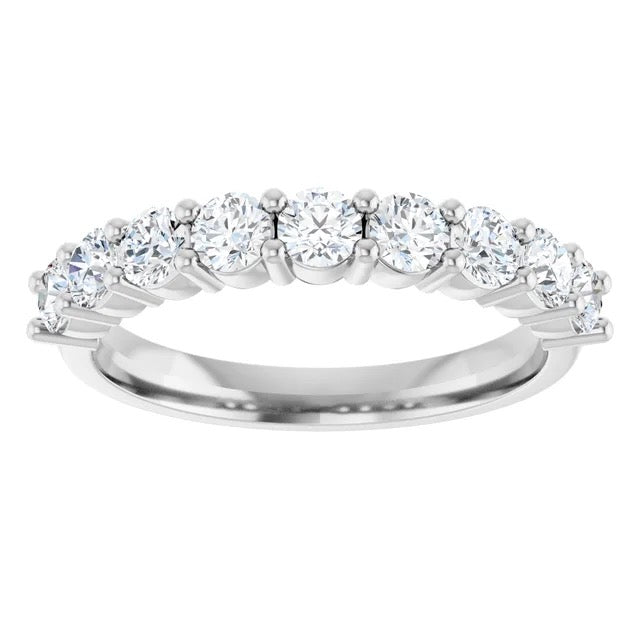 Diamond ring with multiple stones on a white background