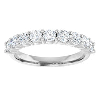 Diamond ring with multiple stones on a white background