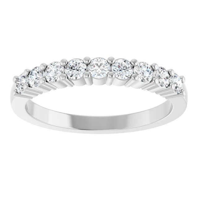 A silver diamond eternity ring featuring a row of round brilliant-cut diamonds set in a polished silver band, shown against a plain white background.