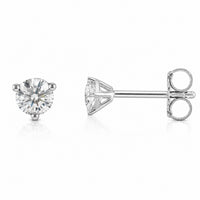 A pair of round-cut diamond stud earrings in silver-tone four-prong settings, shown on a clean white background with one earring facing forward and the other showing the side profile with butterfly backing.