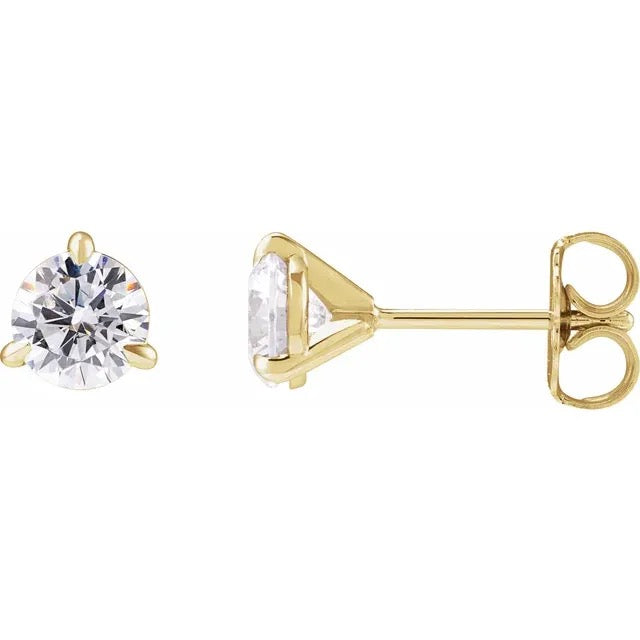 Gold stud earrings with clear gemstones on a white background