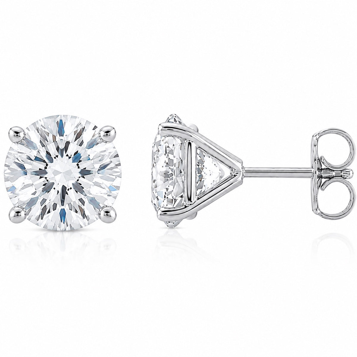 A pair of silver stud earrings, featuring one round-cut diamond solitaire and one triangular-cut diamond with a side stone, set in polished silver-toned metal on a white background.