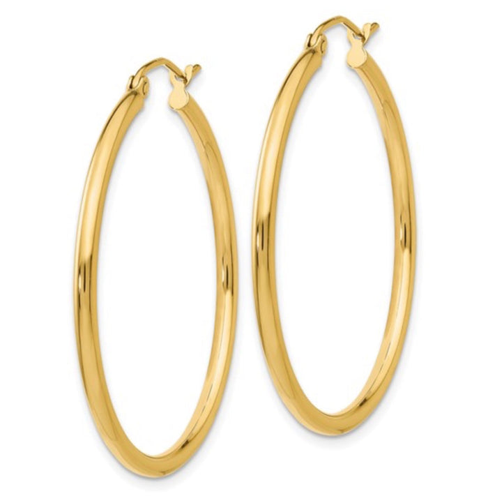 The Karat Concierge 1.5-inch hoop earrings crafted from polished 14K yellow gold with a lightweight, elegant design.
