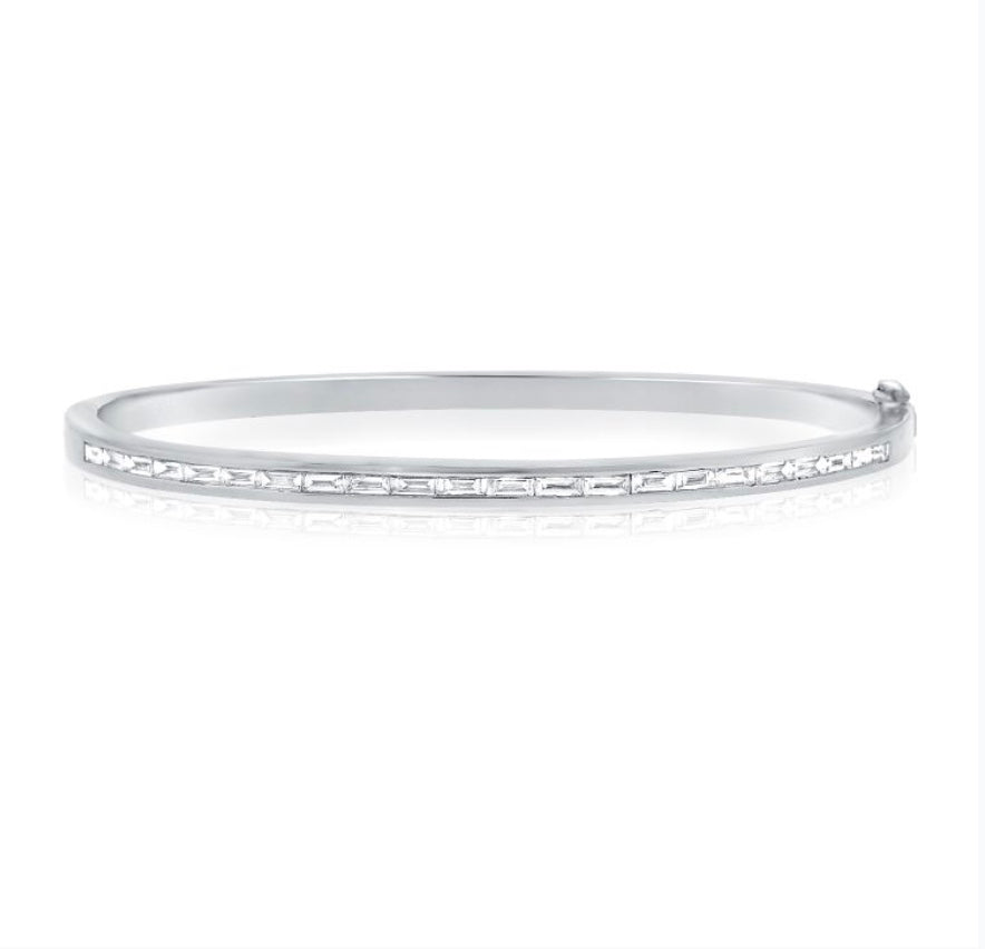 The Karat Concierge channel set bangle featuring baguette diamonds in white gold with a double safety latch