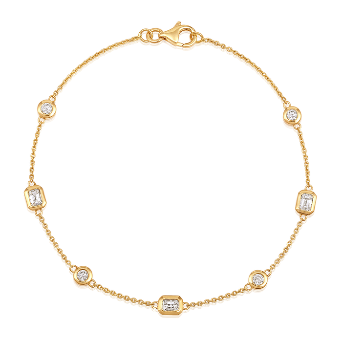 The Karat Concierge Sloane bracelet in 14K yellow gold featuring bezel-set round and emerald-cut natural diamonds.