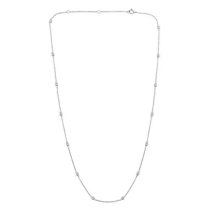The Karat Concierge diamonds by the yard necklace in 14K white gold with bezel set diamonds on a delicate chain.