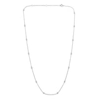 The Karat Concierge diamonds by the yard necklace in 14K white gold with bezel set diamonds on a delicate chain.