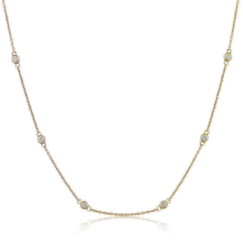 The Karat Concierge diamonds by the yard necklace in 14K yellow gold with bezel set round brilliant diamonds.