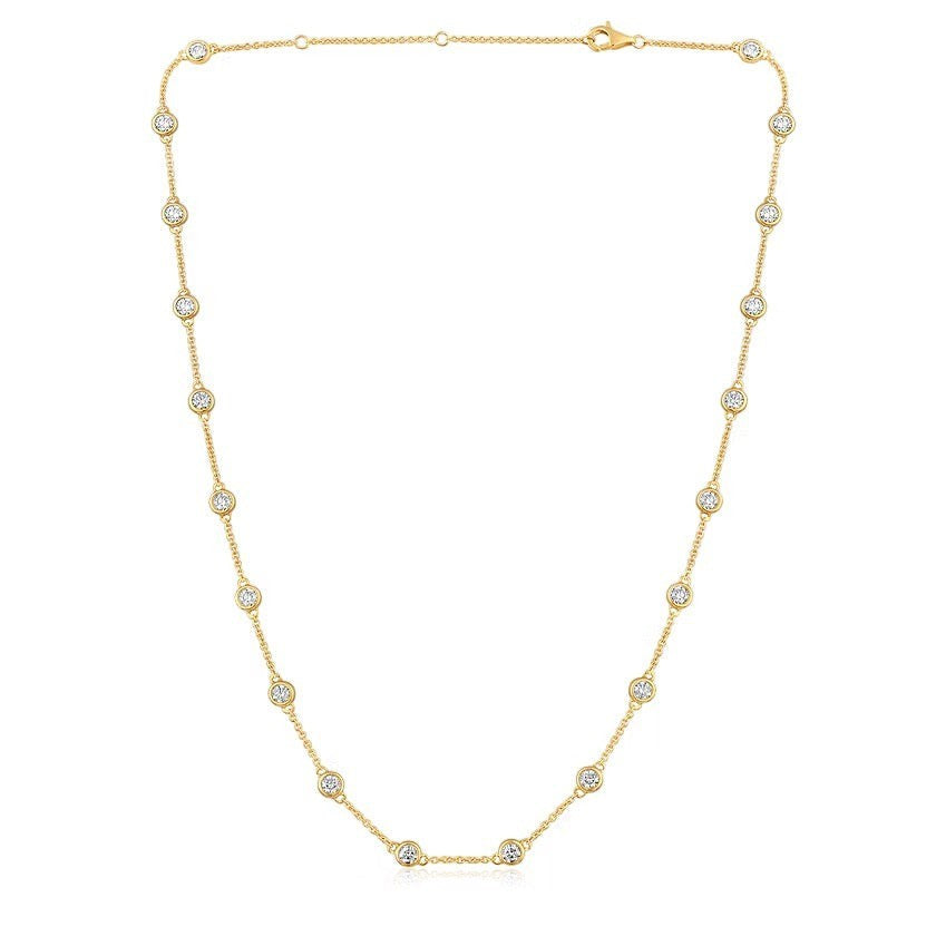 The Karat Concierge diamonds by the yard necklace in 14K yellow gold with bezel set round diamonds on a delicate chain.