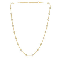The Karat Concierge diamonds by the yard necklace in 14K yellow gold with bezel set round diamonds on a delicate chain.