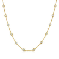 The Karat Concierge diamonds by the yard necklace featuring bezel set round diamonds in 14K yellow gold chain
