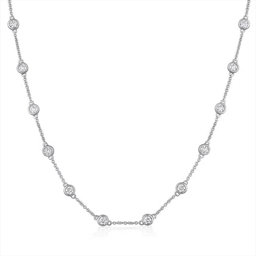The Karat Concierge diamonds by the yard necklace in 14K white gold with bezel set round brilliant cut diamonds.