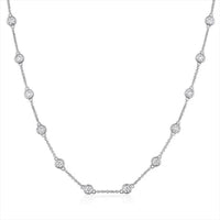 The Karat Concierge diamonds by the yard necklace in 14K white gold with bezel set round brilliant cut diamonds.