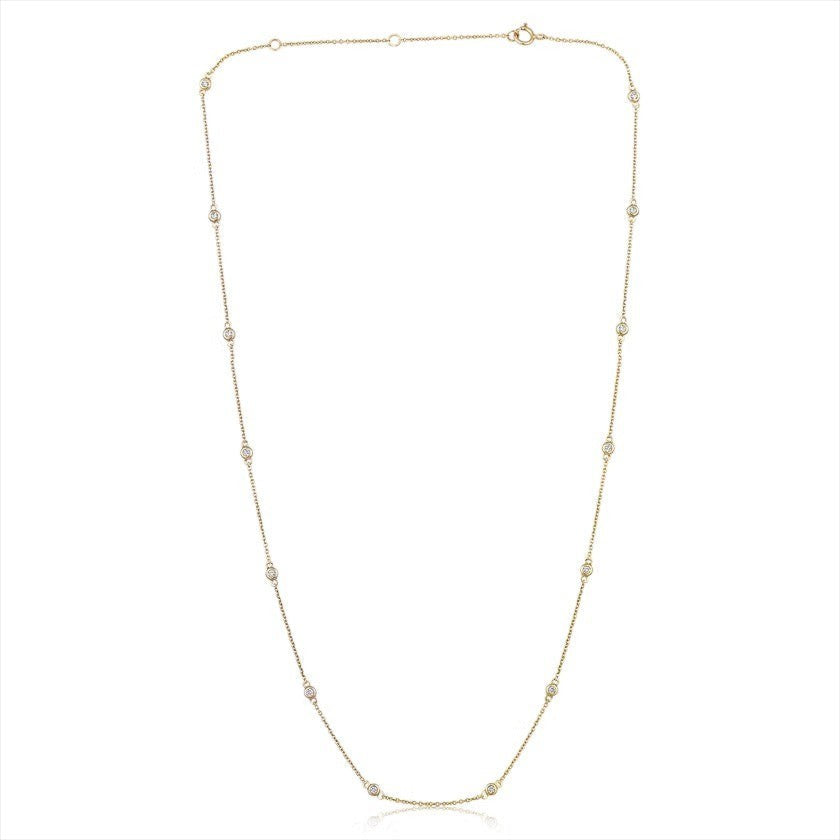 The Karat Concierge diamonds by the yard necklace in 14K gold with bezel-set natural diamonds on a delicate chain.