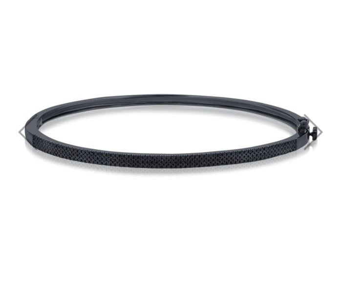 The Karat Concierge black diamond bangle featuring .66 CTW pave diamonds set in sleek black rhodium with double latch.