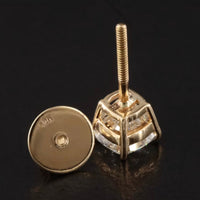 The Karat Concierge cushion cut diamond stud earrings in 18K yellow gold with secure threaded posts and earring backs.