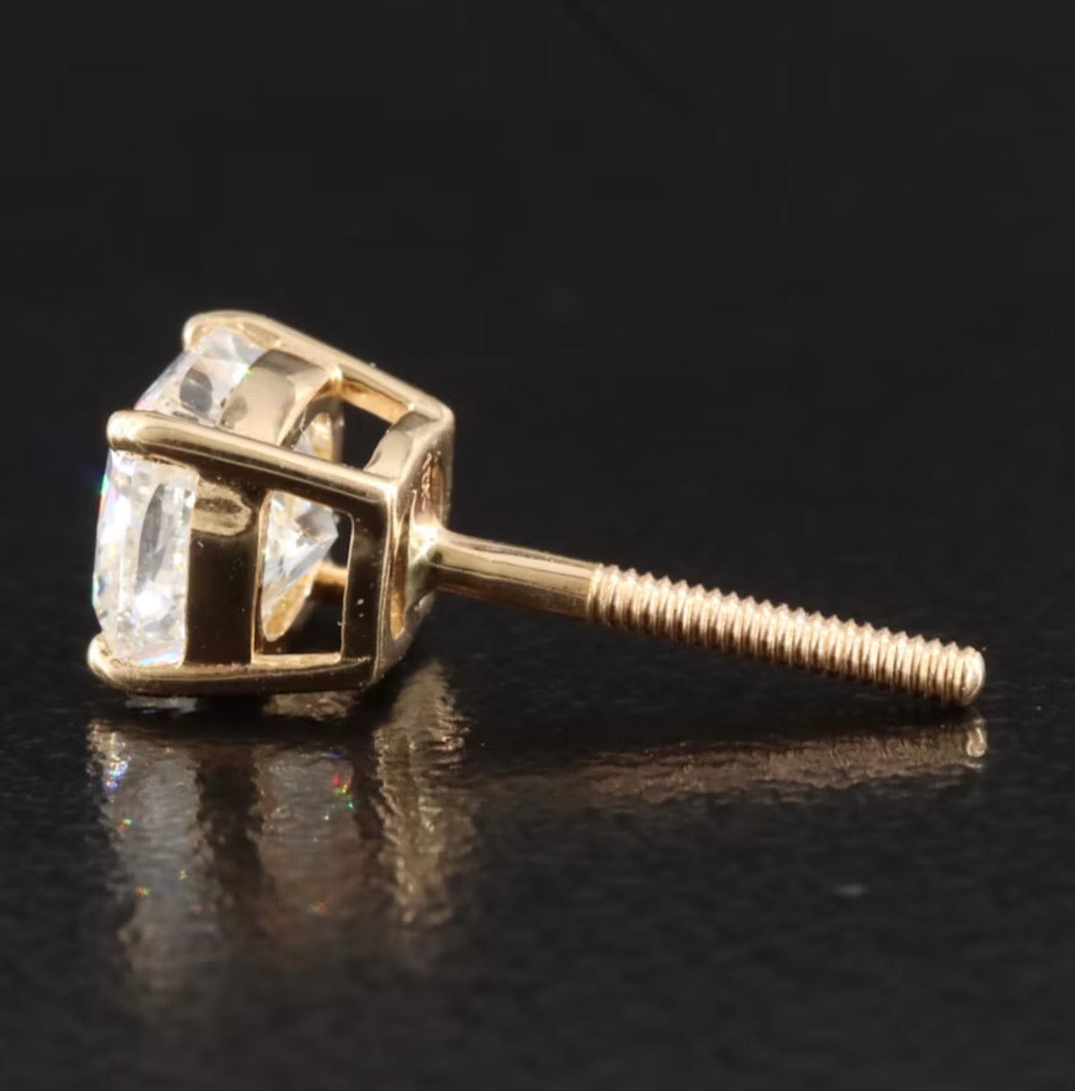 The Karat Concierge cushion cut diamond stud earring in 18K yellow gold with a secure threaded post, side view.