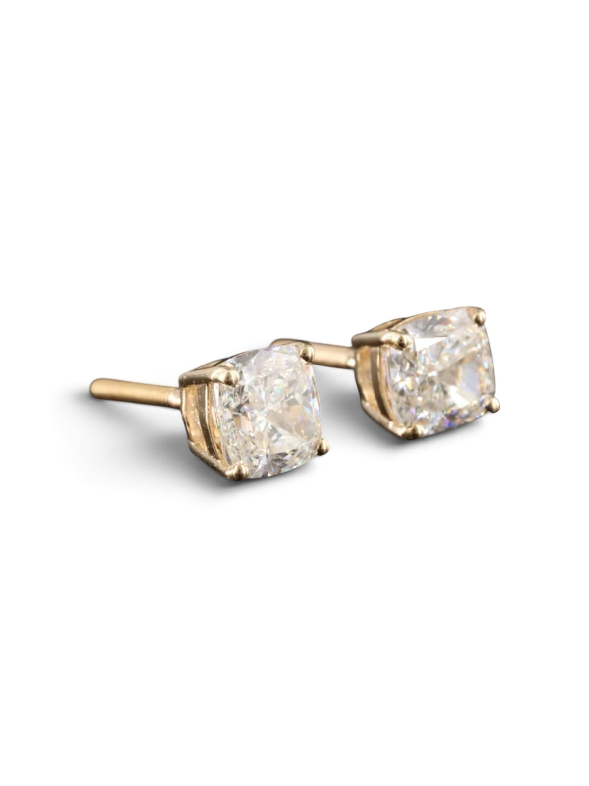 The Karat Concierge 2.08 CTW cushion cut diamond stud earrings set in 18K yellow gold with secure threaded posts.