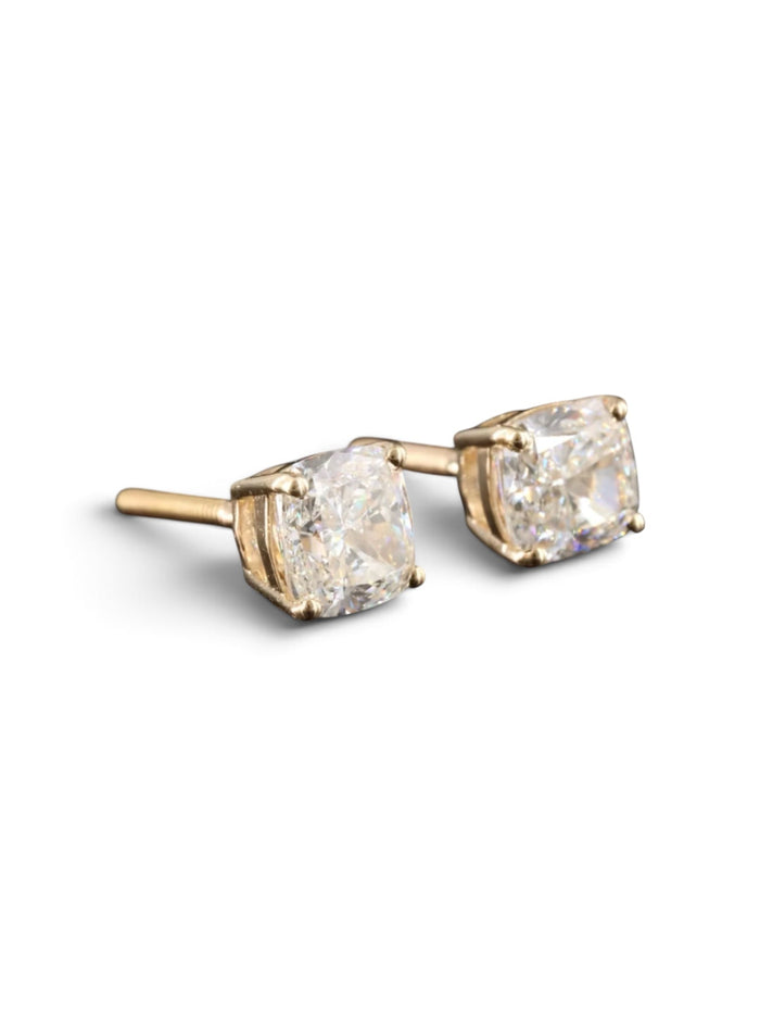The Karat Concierge 2.08 CTW cushion cut diamond stud earrings set in 18K yellow gold with secure threaded posts.