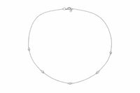 The Karat Concierge diamonds by the yard necklace in 14K white gold with five bezel-set natural diamonds.