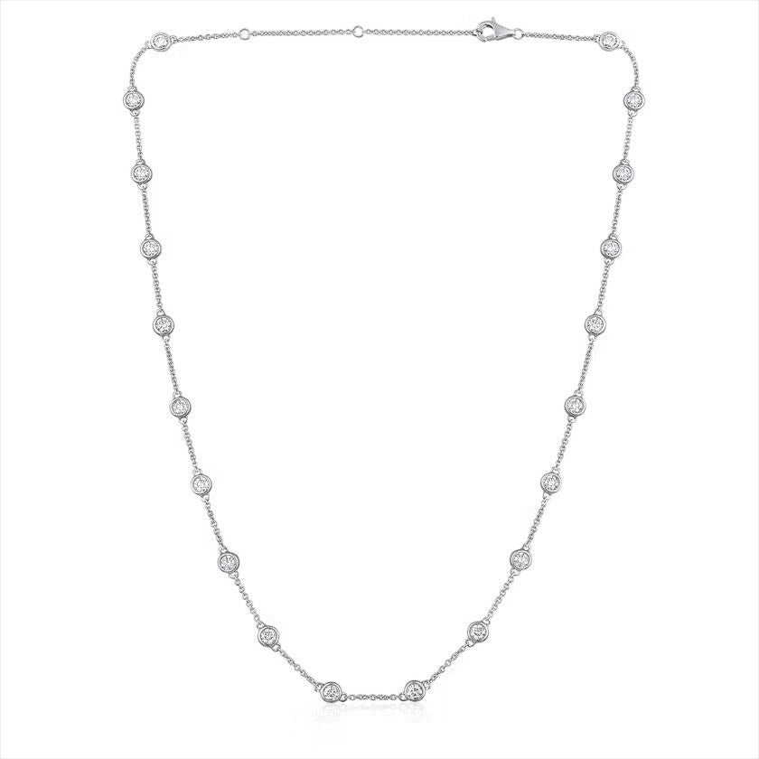 The Karat Concierge diamonds by the yard necklace in 14K white gold with bezel set round diamonds on a delicate chain.